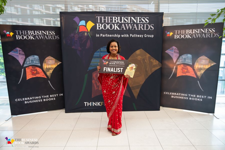 The author at the Business Book Awards 2024, holding the finalist sign