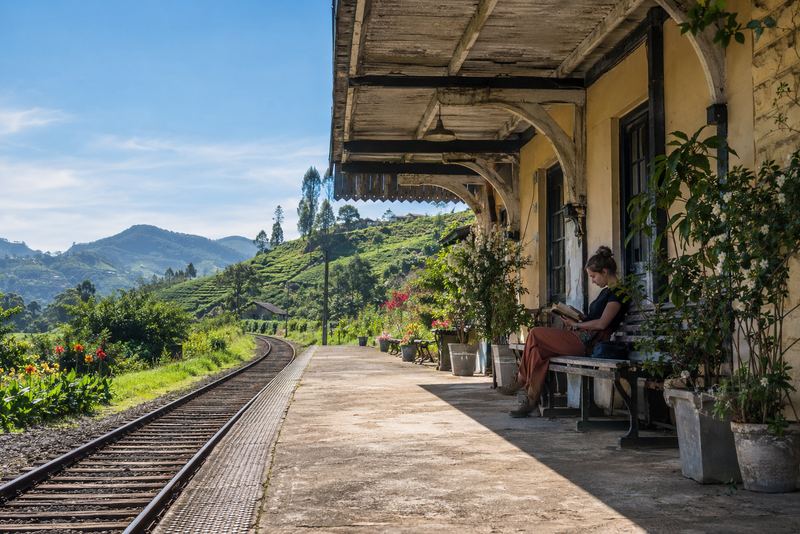 A converted hill-country railway station with a guest reading