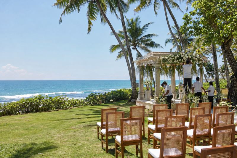 A villa garden set for a wedding with a flower-decked poruwa