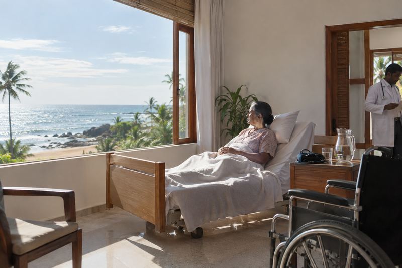 A recuperation room by an open window over the sea