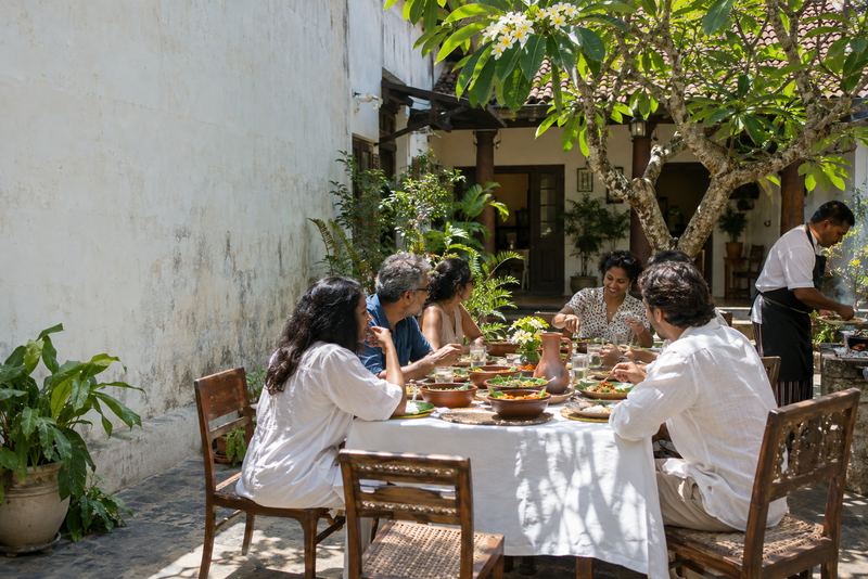 A courtyard lunch table in an old Colombo house in sunshine