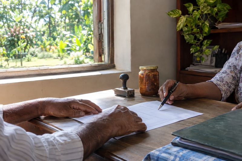 An adviser and a producer going through an export form
