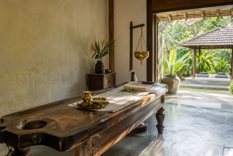 An Ayurveda room opening onto a sunny garden pavilion