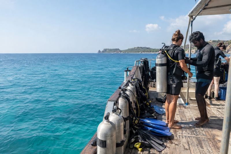 Divers preparing on a boat off Trincomalee in morning sun