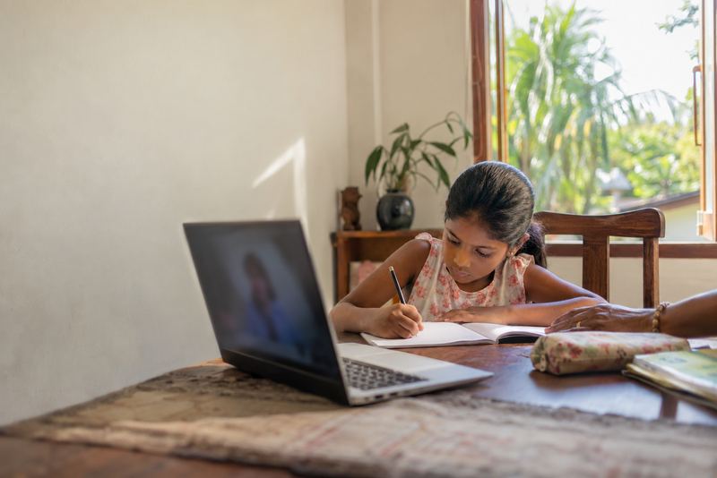 A child having an English lesson by video at home