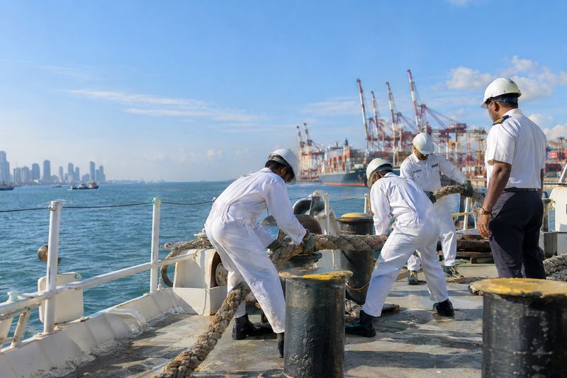 Maritime cadets handling mooring ropes on a training ship