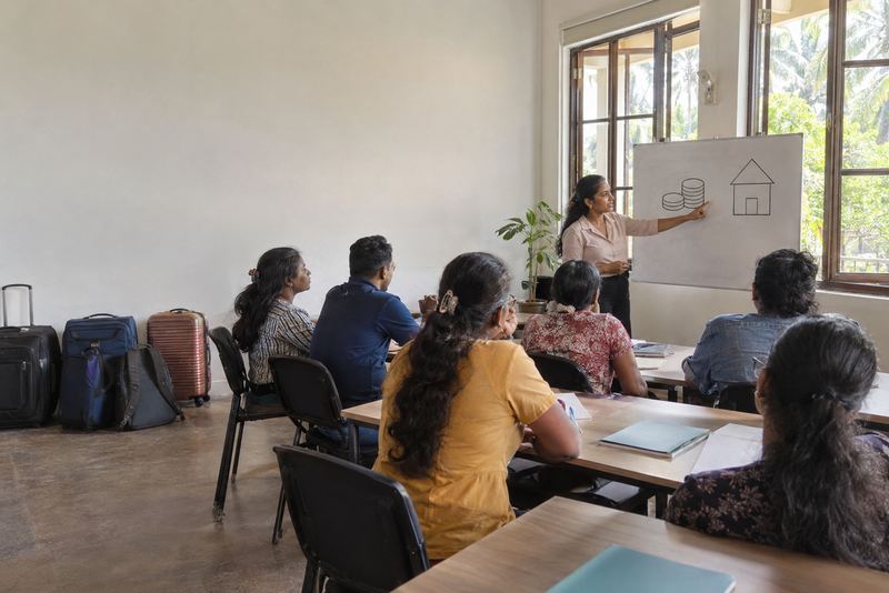 Workers in a money class before going abroad