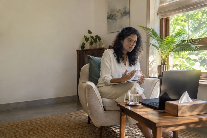 A counsellor speaking to a client by video