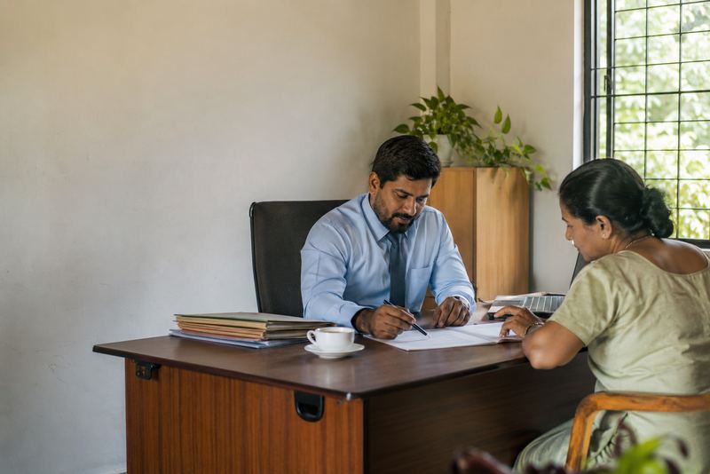 An adviser going through a form with a client