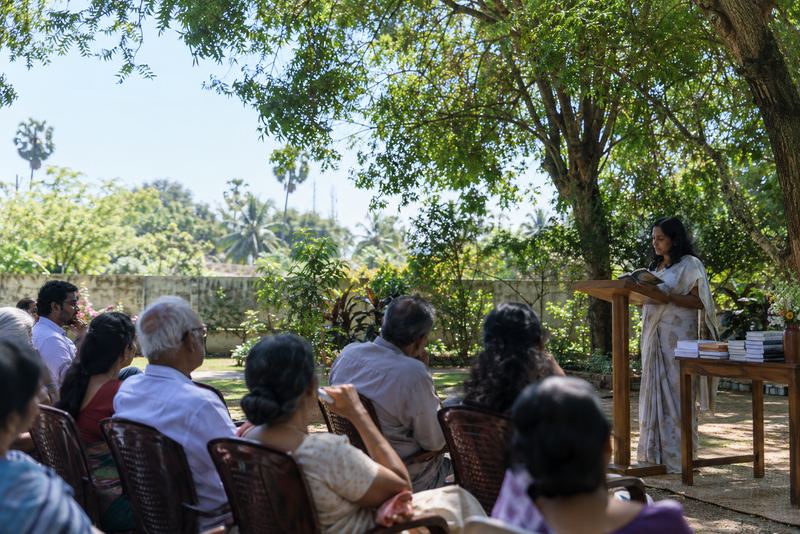 A literary festival reading in a sunny Jaffna garden