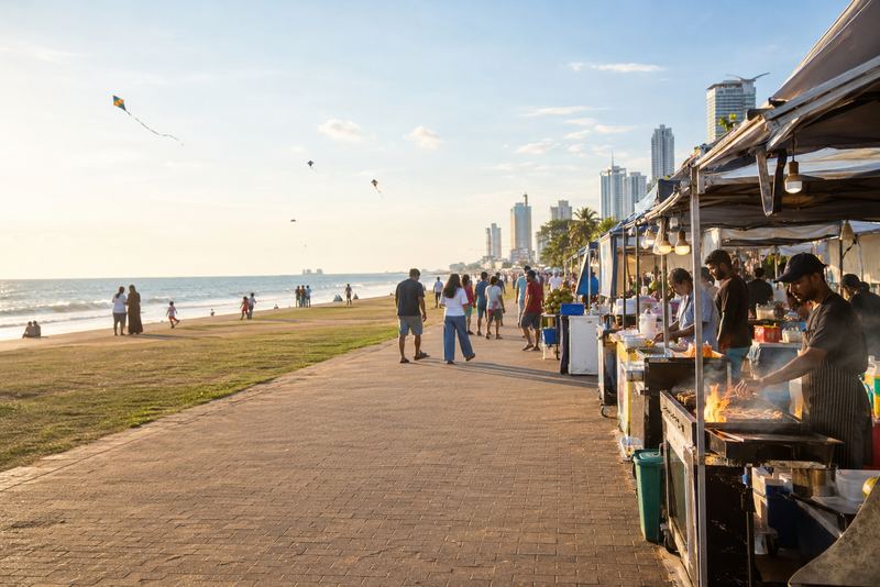 Food stalls setting up on a sunny Galle Face Green